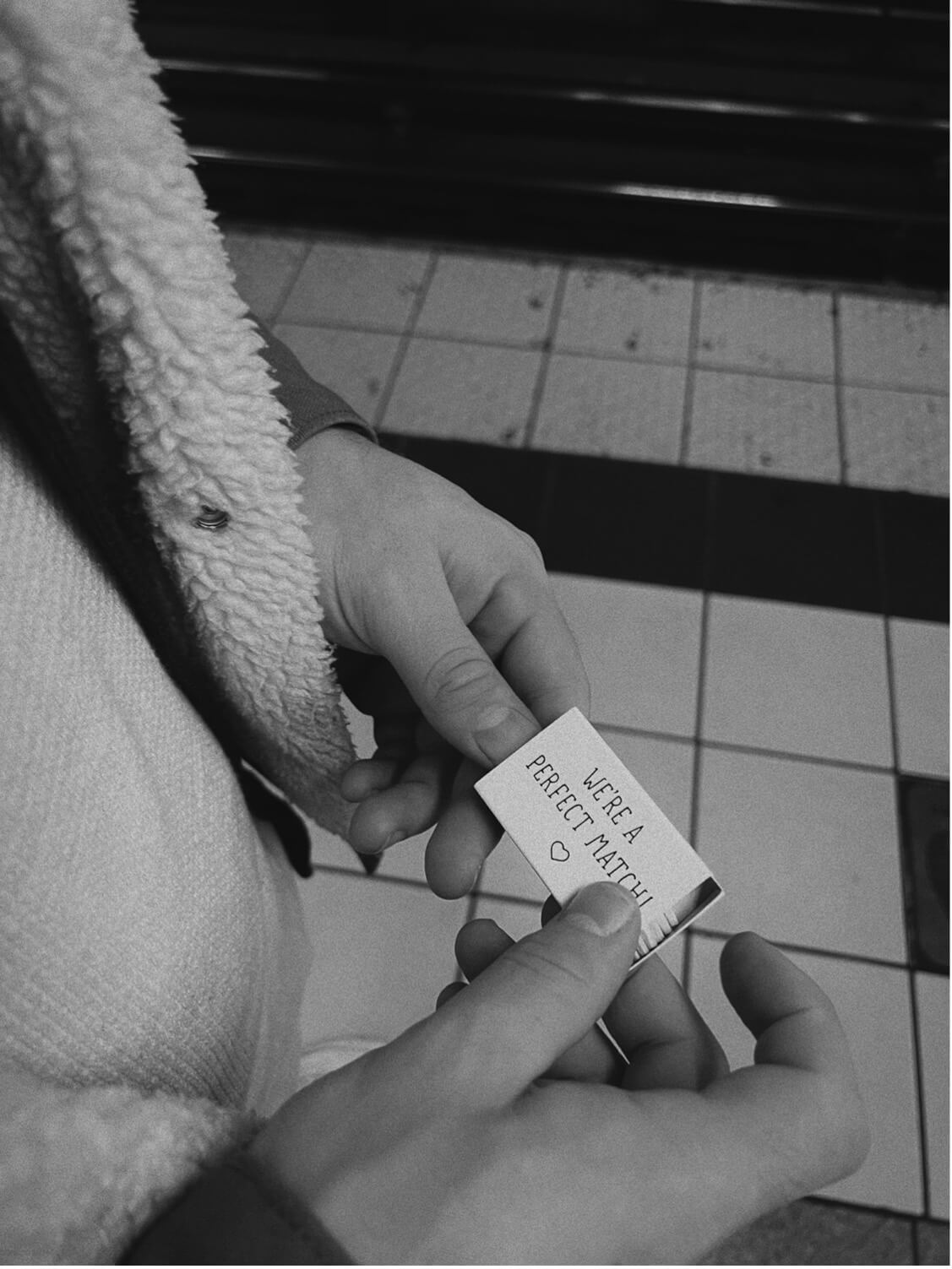 A person scrolling through a curated social media feed on their phone, representing social media management services.